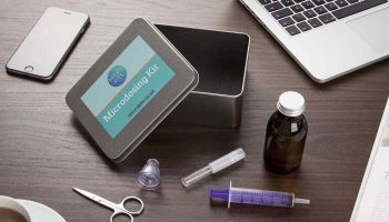 microdosing kit, a laptop and an iphone