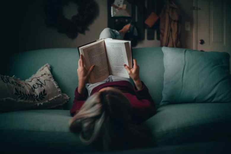 woman reading on the couch