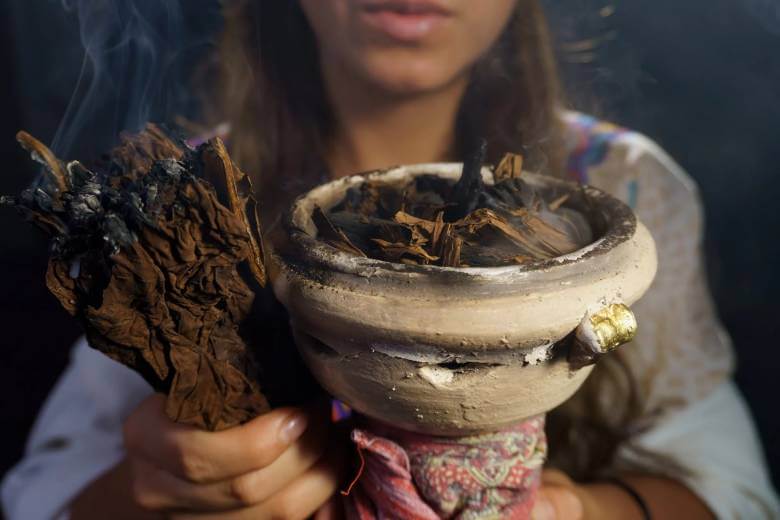 woman burning tobacco