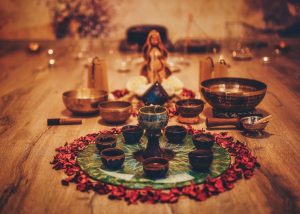 Beautiful ayahuasca like altar with rose petals and goddess statuette. ceremony space.