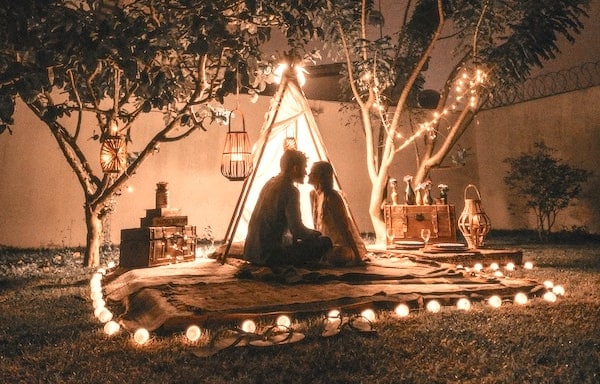 couple sitting together outside preparing for psychedelics and sex