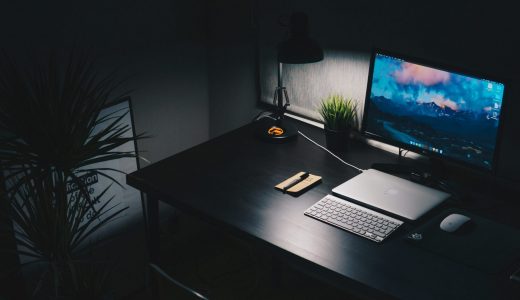 desk with computer and laptop