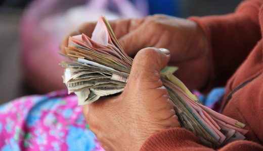 man counting money